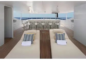 SUNONE - Looking forward beneath the sun deck's hardtop towards the large sit-up bar
