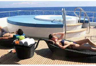 The raised jacuzzi and sun lounging space aft on the sun deck