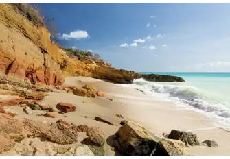 The sandstone cliffs enclosing Cupecoy Bay in far west Sint Maarten