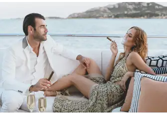 Smoking inside is definitely not allowed when chartering but there may be a sheltered deck space where you can light up. Check with your charter broker
