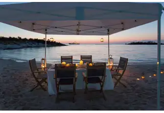 After a day's fun on the water, feel the sand between your toes dining on a secluded beach
