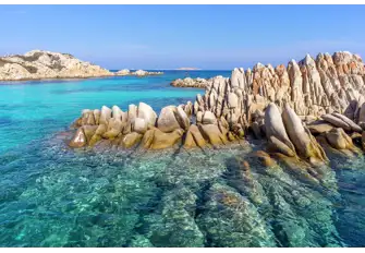 The gin clear waters and characteristic granite rock formations of Sardinia's La Maddalena archipelago