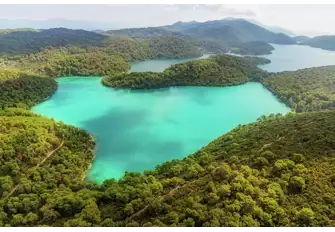Two interconnected saltwater lakes lie amid the oldest pine forest in Europe in Mljet National Park, where there are great cycling and walking trails