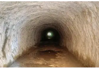 ...passes through two tunnels hewn through the rock...