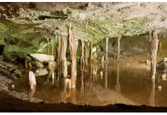 Escape the heat of the day by exploring the caves of Can Marçà