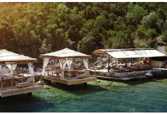 Take the tender to the Bowa Beach Club on Sipan and enjoy a fresh red snapper under the shade of the thatched-roof cabanas with a perfect view