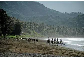 Go horse-riding next to the Pacific Ocean along unspoilt Tambor Beach