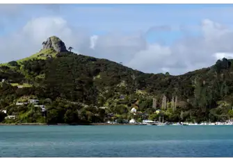 St Paul's Rock stands sentinel over Whangaroa Harbour