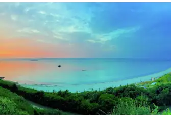 The sun rises over Salins Beach